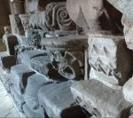 Decorative photograph of a pile of carved stones